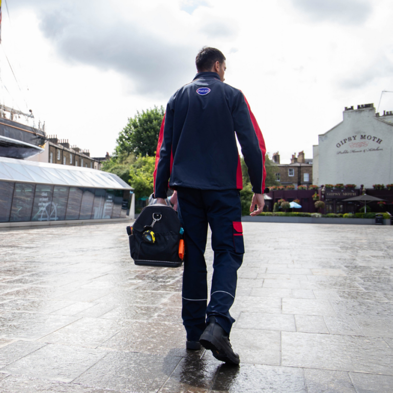 Pimlico engineer walking by the Cutty Sark in Greenwich