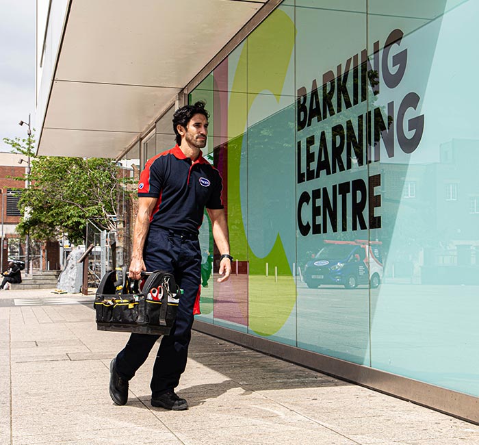 Pimlico engineer walking next to the Barking Learning Centre