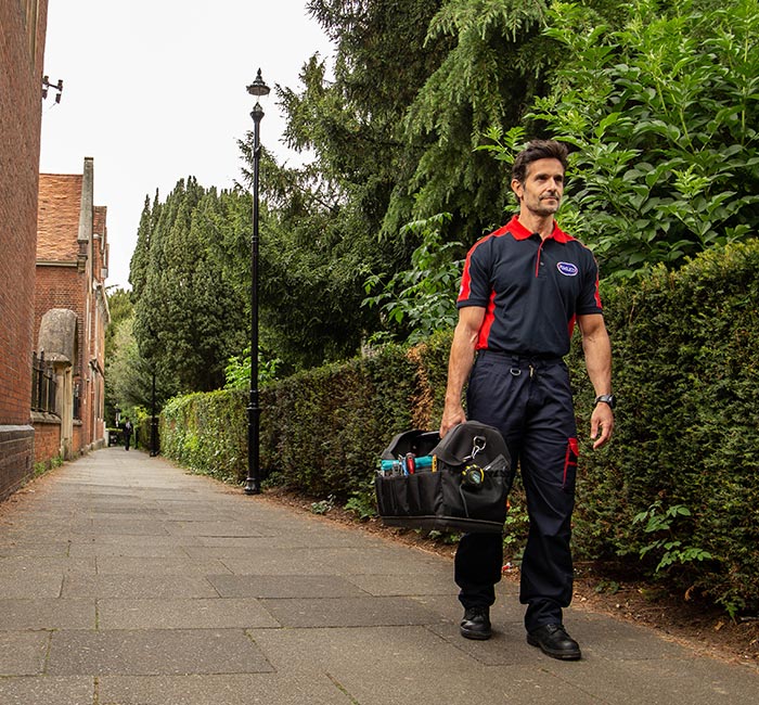 Pimlico engineer walking down a street in Enfield