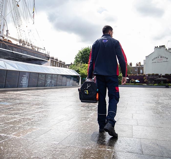 Pimlico engineer walking by the Cutty Sark in Greenwich