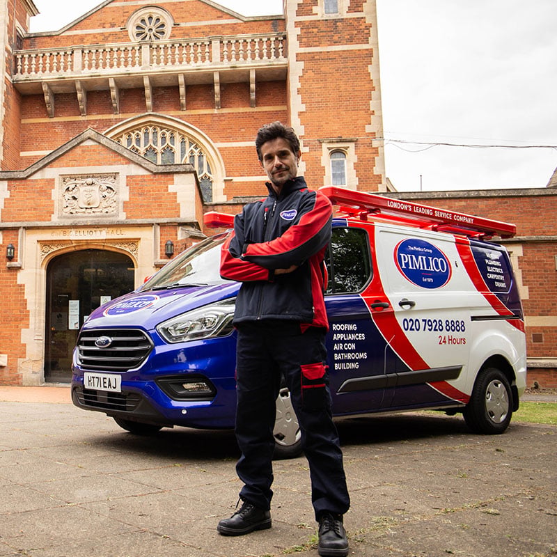 Pimlico engineer and van outside the Elliot Hall in Harrow