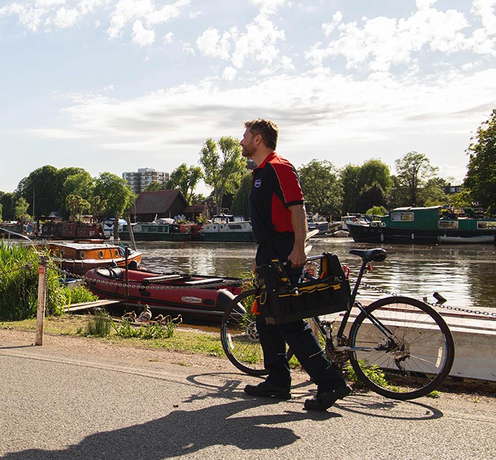 Pimlico engineer walking by the Thames in Kingston