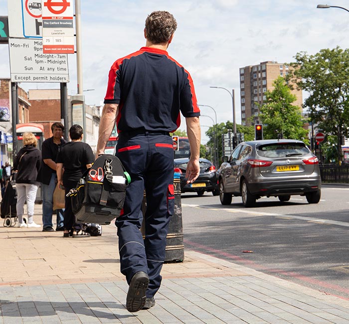 Pimlico engineer walking down a street in Lewisham near the Town Hall