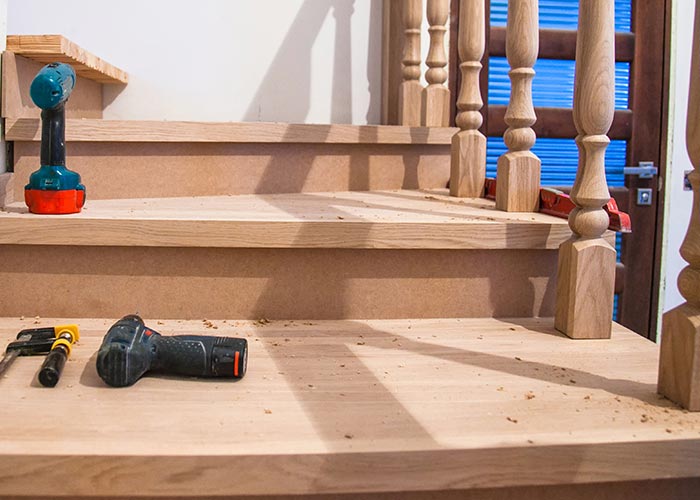 Wooden staircase with tools on it