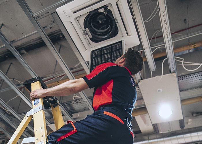 Pimlico engineer installing air conditioning