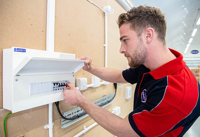 Pimlico electrician working on a fuseboard