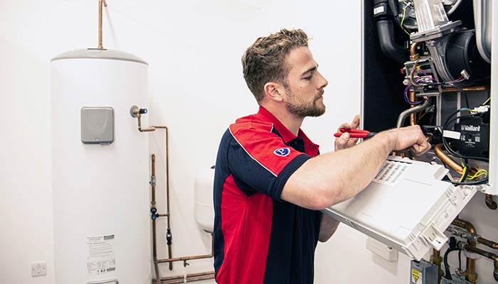 Pimlico heating engineer working on a boiler