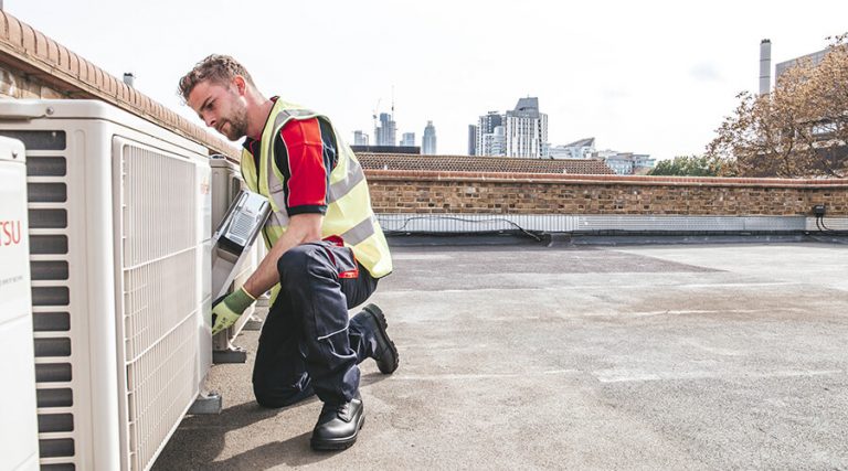 Engineer fixing outdoor air conditioning