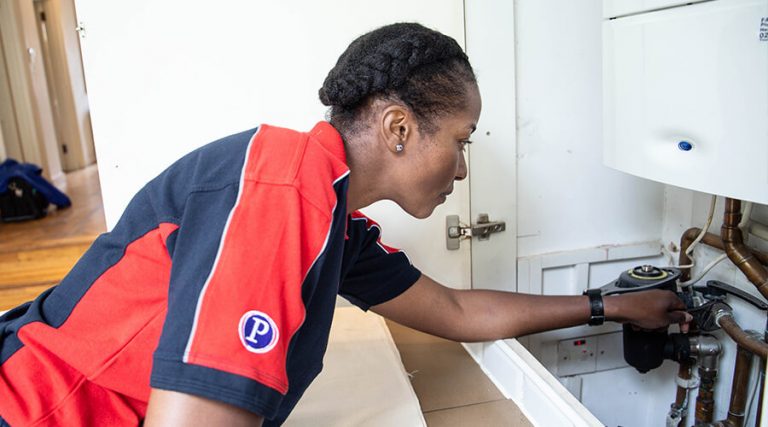 boiler service engineer working on a boiler