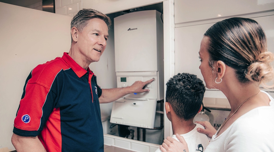 Pimlico Plumber helping test a boiler