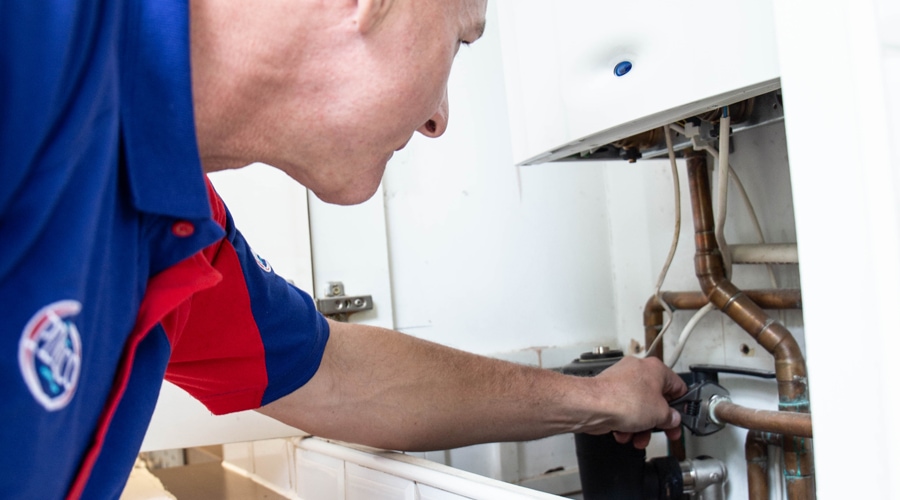 A Pimlico heating engineer fixes a combi boiler