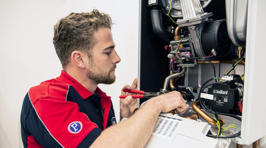 A Pimlico heating engineer checks the health of a Vaillant gas boiler