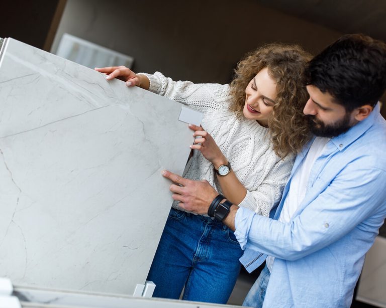 Couple picking their bathroom tile design