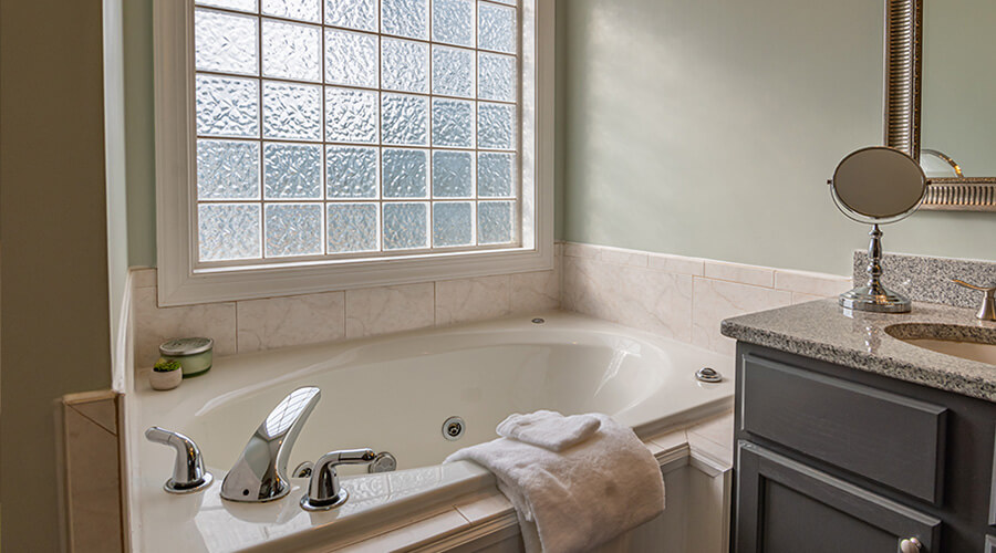 French country style bathroom with wide window