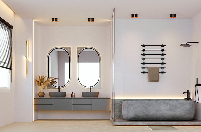 contemporary bathroom with large oval mirrors