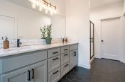transitional bathroom with large mirror