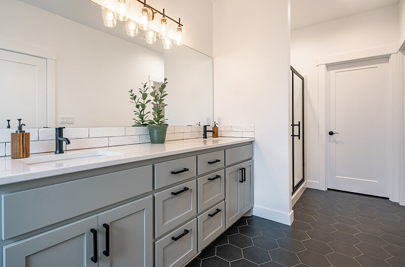 transitional bathroom with large mirror