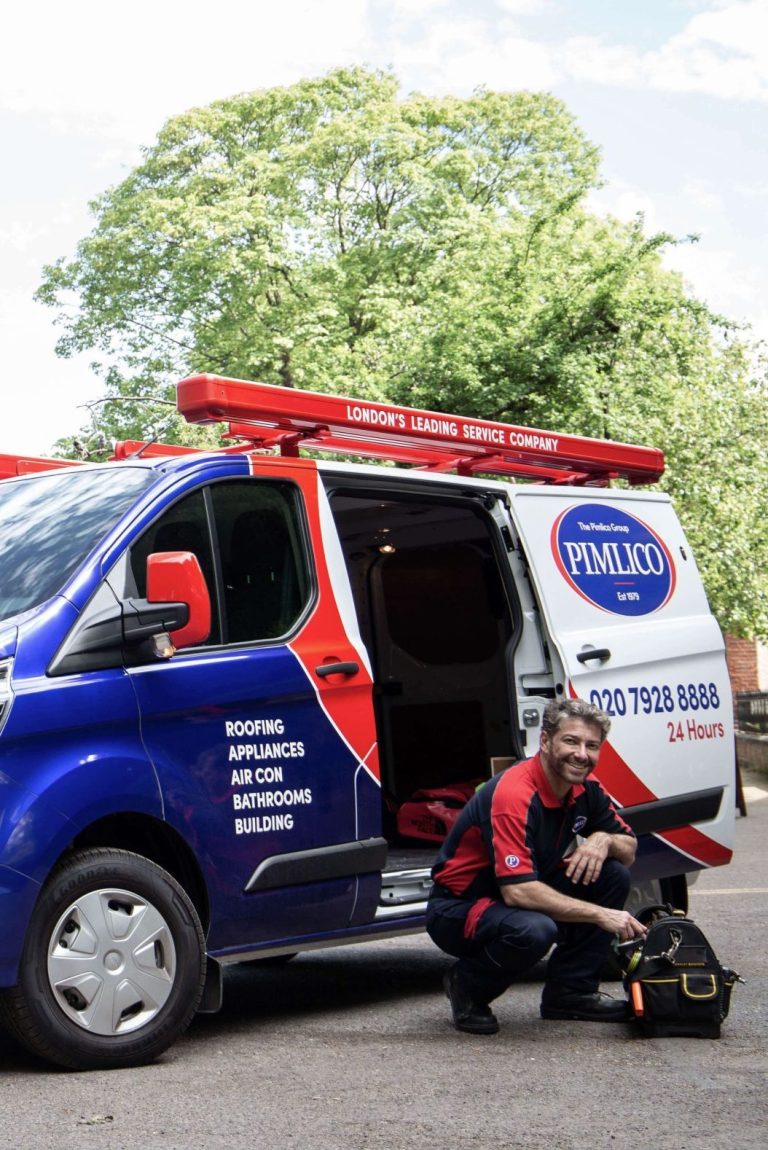 Pimlico Heating Engineer Knelt by Van