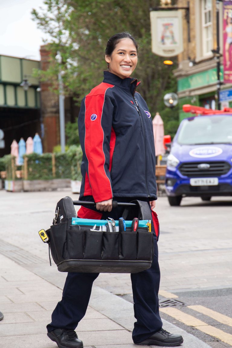 Pimlico Engineer Stood Holding Tool Bag