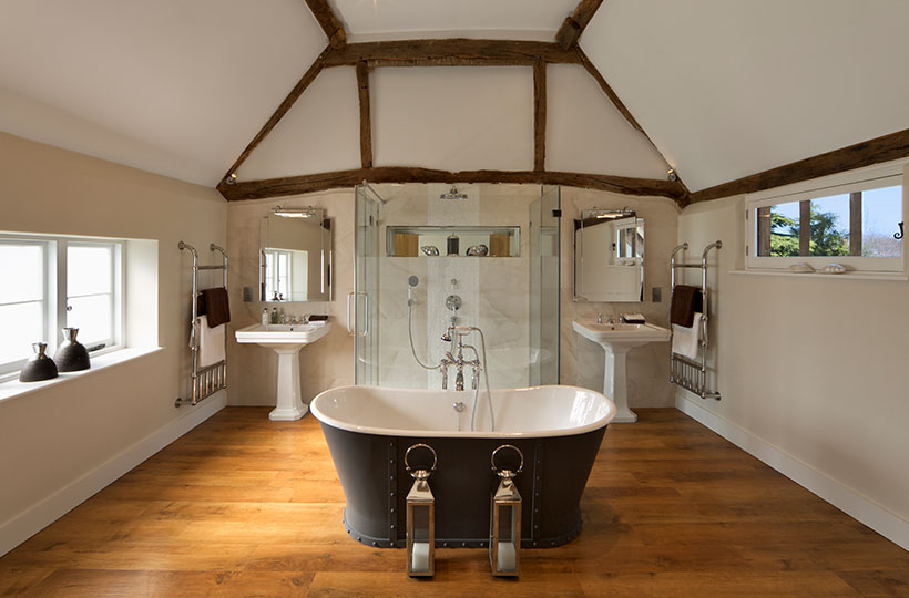 traditional bathroom with roll top bath