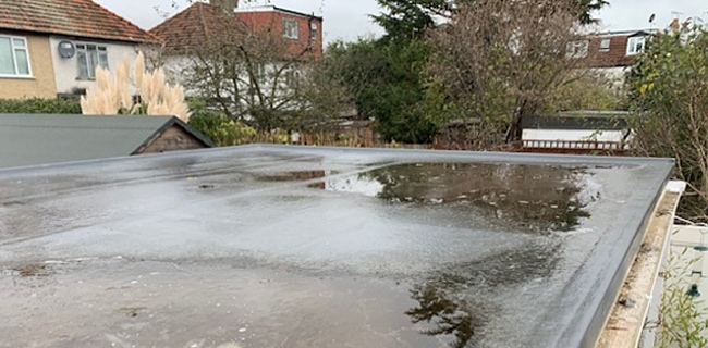 ponding water on flat roof