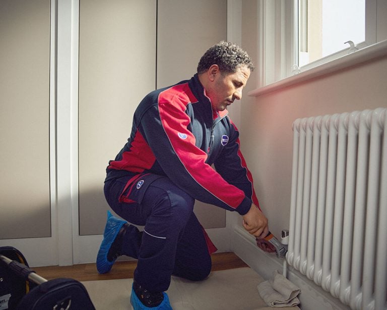 Pimlico engineer repairing a radiator