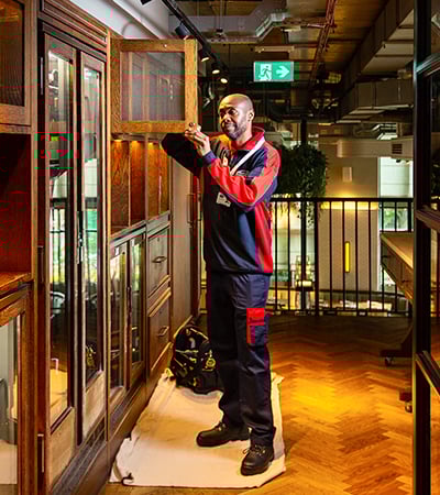 Pimlico carpenter fixing a cupboard door