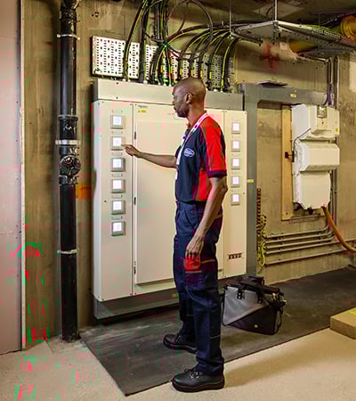 Pimlico electrician checking a electric pannel