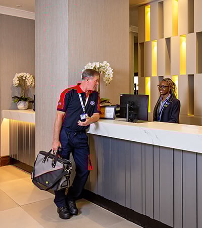 Pimlico engineer talking to a hotel receptionist