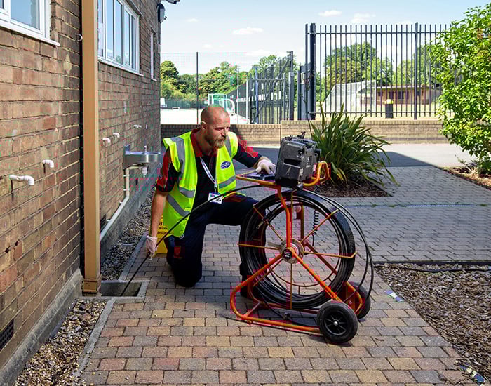 Pimlico drainage engineer checking a drain with CCTV