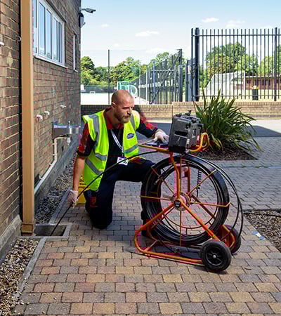 Pimlico drainage engineer checking a drain with CCTV