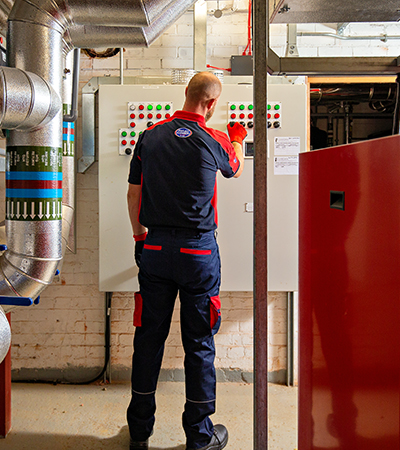 Pimlico heating engineer working on a boiler