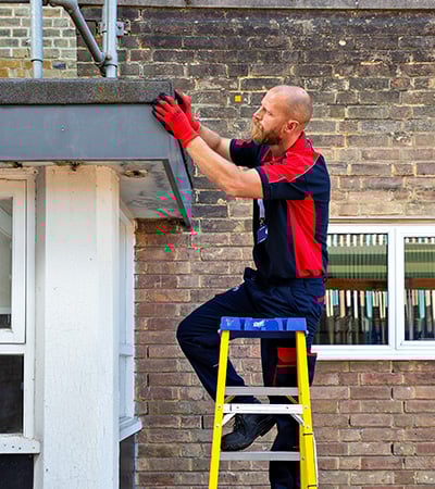 Pimlico roofer inspecting a flat roof