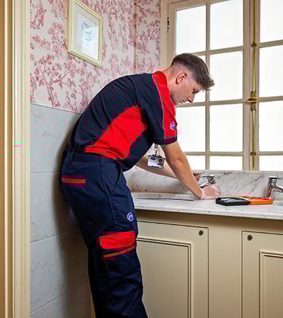Pimlico plumber fixing a tap