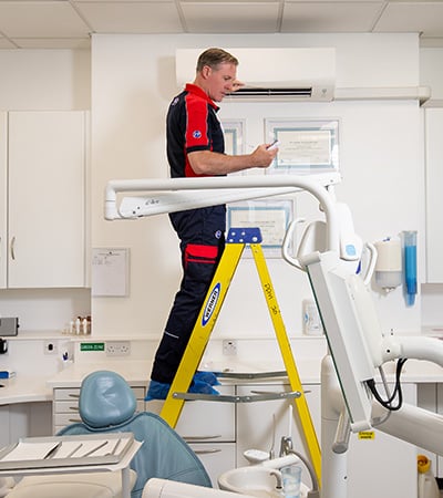Pimlico air con technician testing a unit