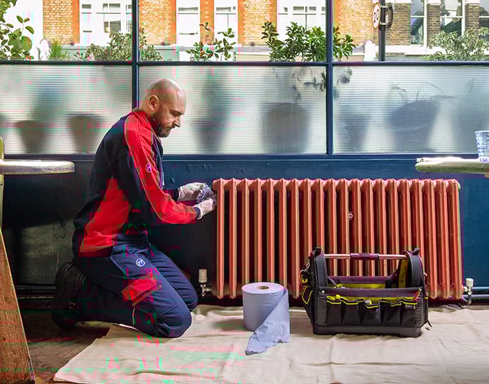 Pimlico heating engineer fixing a radiator