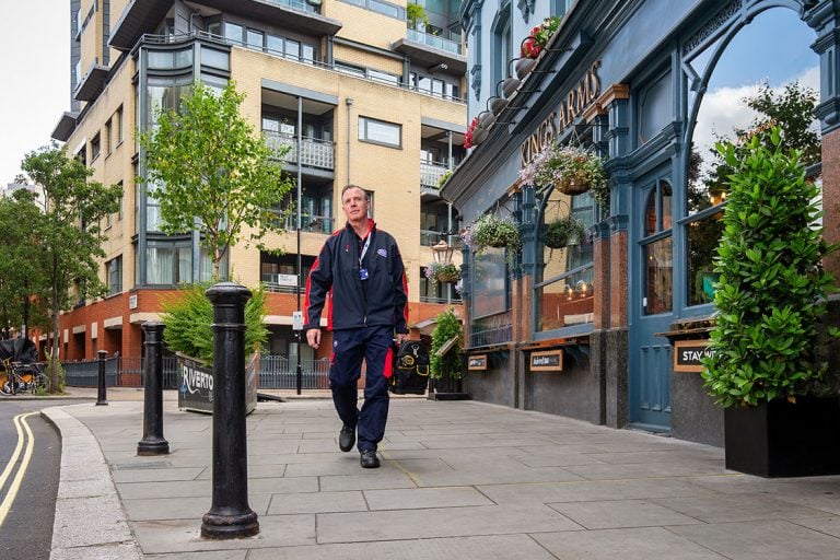 Pimlico engineer walking by a pub