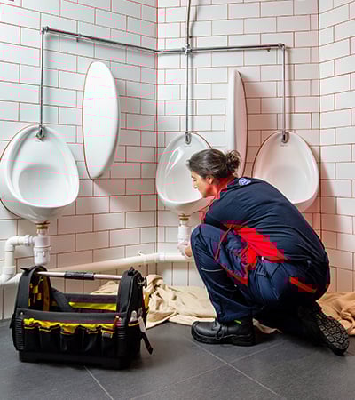 Pimlico plumber changing urinal trap