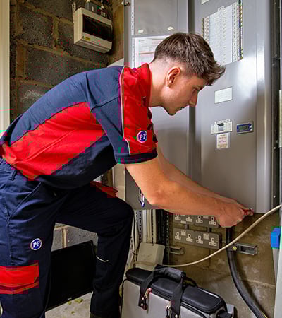 Pimlico electrician working on a commercial fuseboard