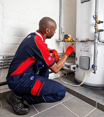 Pimlico heating engineer checking a water tank