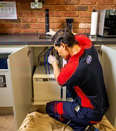Pimlico plumber working on a boiling water tap