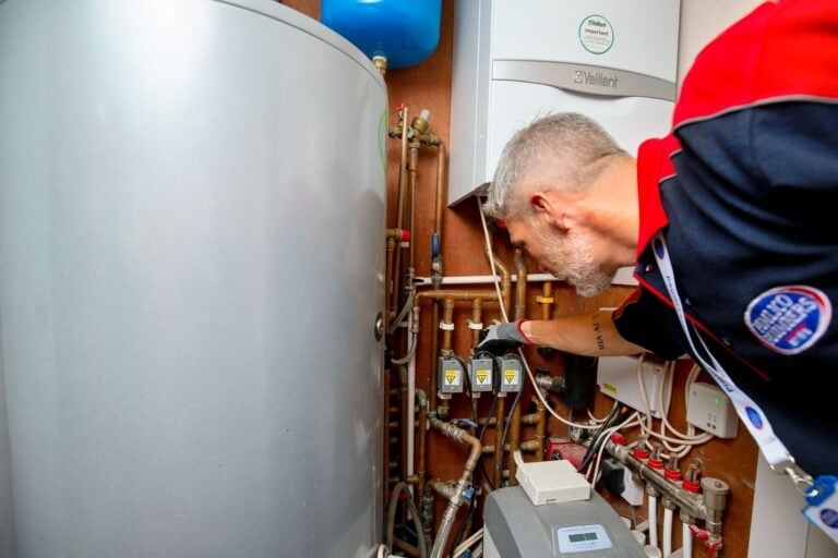 Gas Safe Engineer assessing a boiler in an emergency