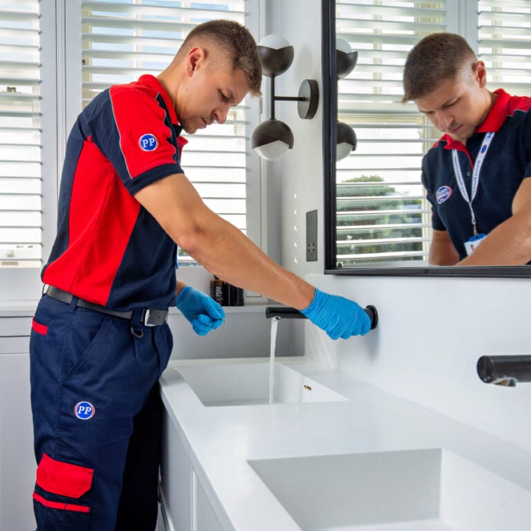 Plumber testing tap