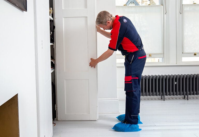 Pimlico carpenter fixing a door