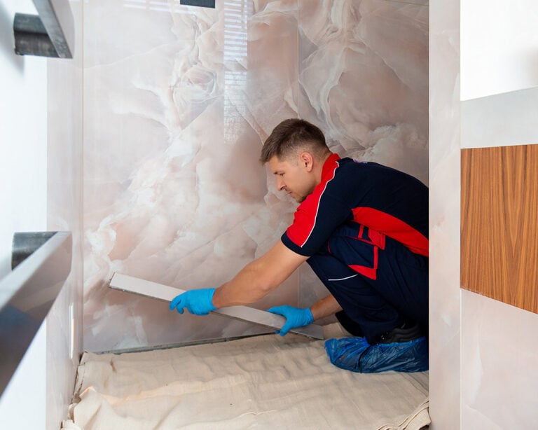 Pimlico plumber fixing a shower drain